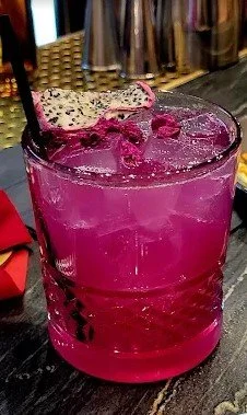 The Corazón Rosa — a dragonfruit margarita in a coupe glass